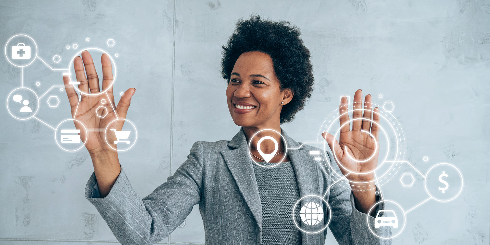 Businesswoman moving in the air with hands intelligent graphics with various icons of smart technolo
