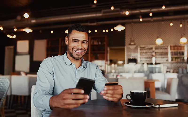 man with debit card